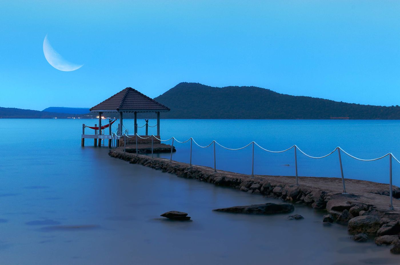 Laguna pier over calm blue water at dusk